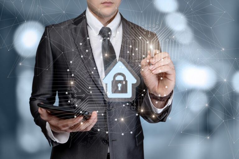 Man works out the protection of the house on a blurred background.