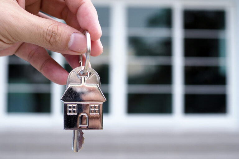 lease, rental and selling home. Real estate agent manager smile holding key for new owner.  rent house, Sales, loan credit financial, insurance, Seller, dealer, installment,  buy, sell, move in